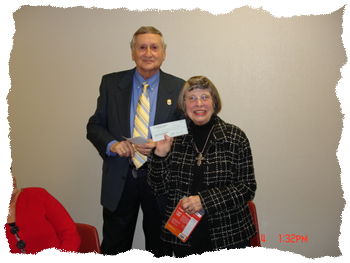 Marshall Regional Arts Council President presents check to Waskom Library for Playaways